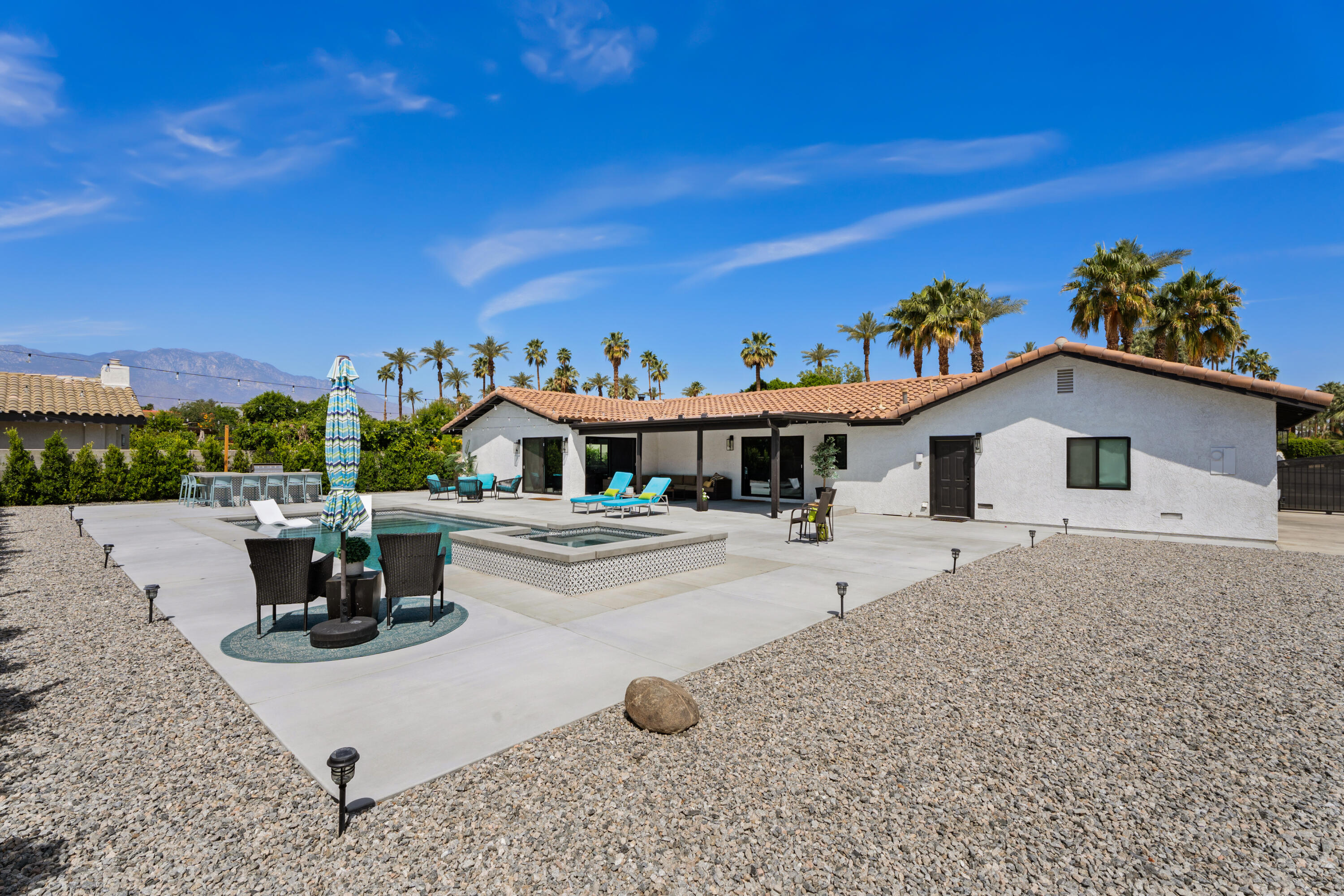 70443 Chappel Road Rancho Mirage, CA 92270 - Photo 8 of 36 a front view of a house with a yard