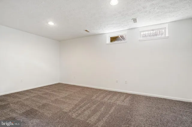 a view of an empty room with stairs