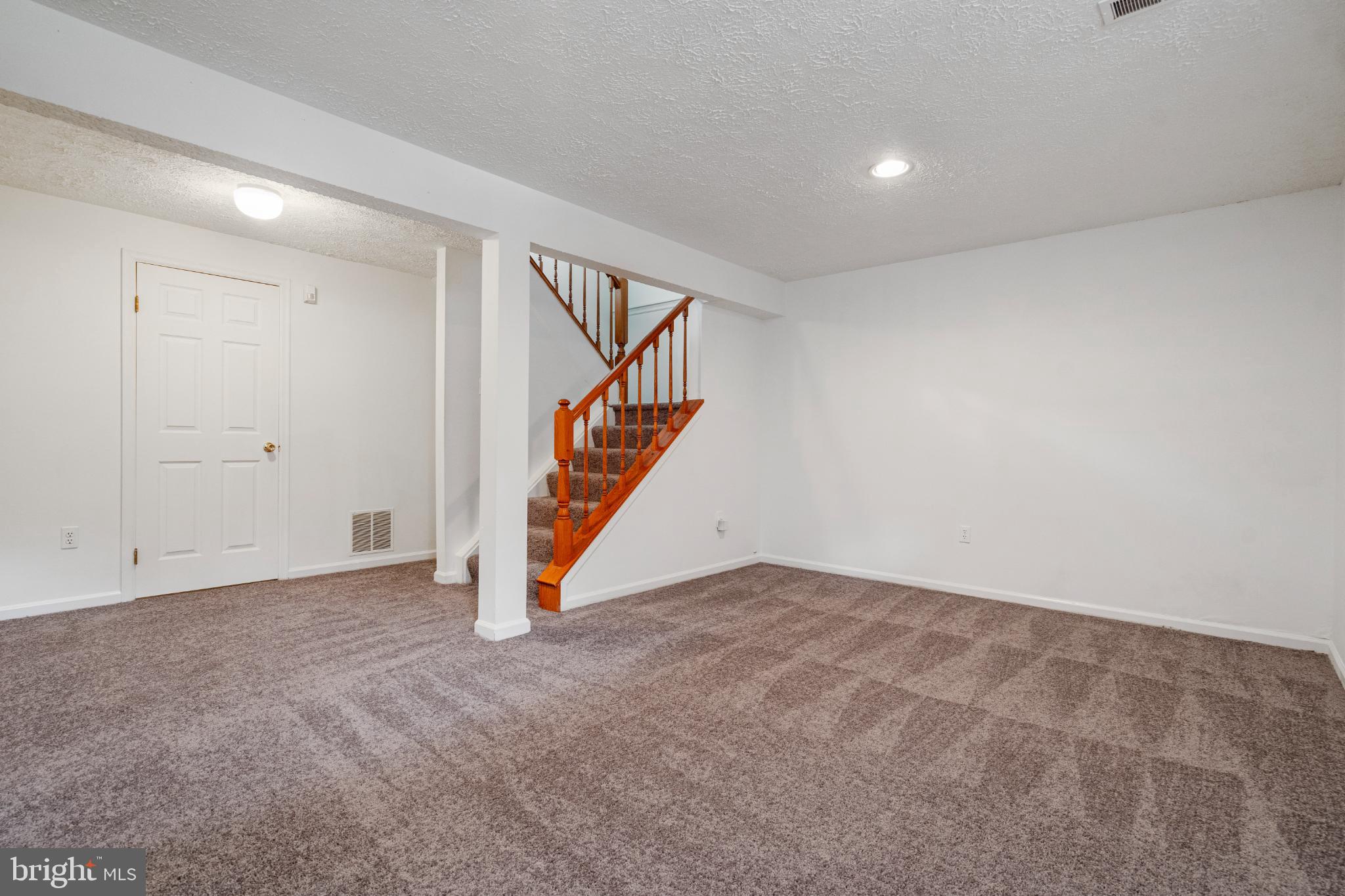 3322 Raccoon Court Abingdon, MD 21009 - Photo 33 of 44 a view of an empty room with stairs