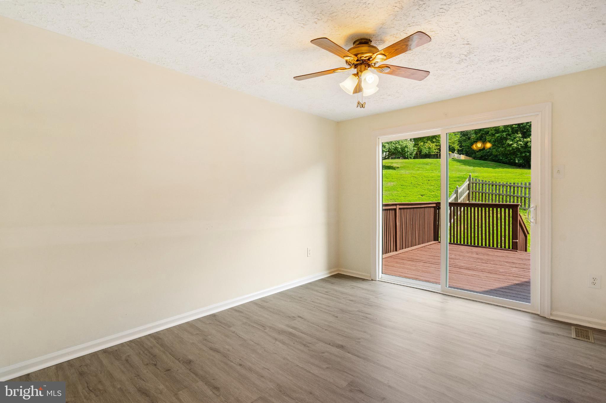 3322 Raccoon Court Abingdon, MD 21009 - Photo 8 of 44 an empty room with a ceiling fan and window