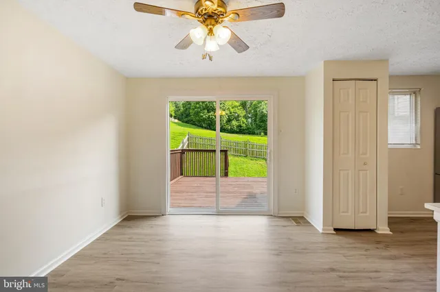 a kitchen with a refrigerator and a stove top oven