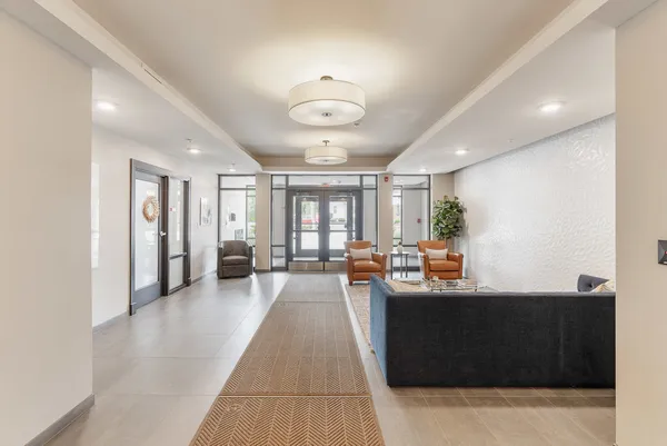 a lobby with furniture and a large window