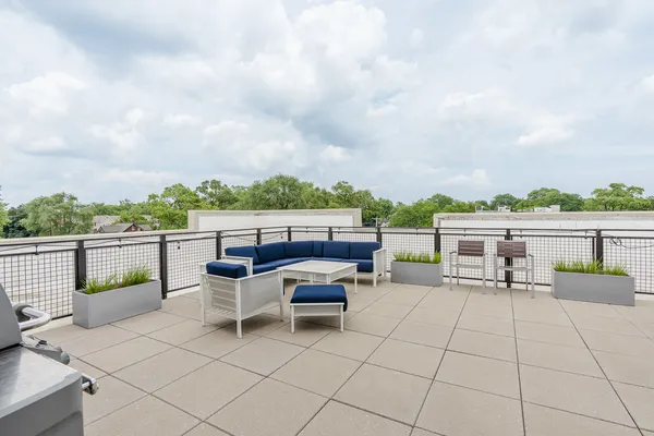 a view of a terrace with chairs