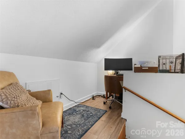 a living room with furniture and flat screen tv