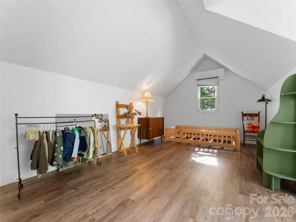 a view of a livingroom with wooden floor