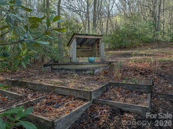 a front view of a house with shrubs