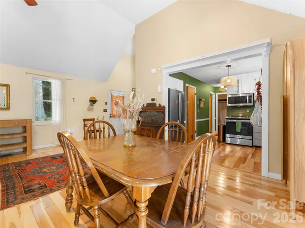 a dining room with furniture and window