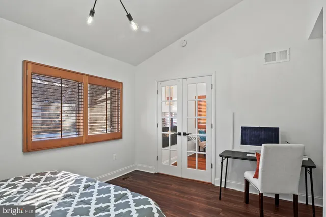 a bedroom with furniture and a window