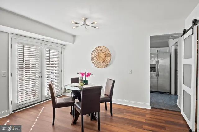 a kitchen with a stove a sink and cabinets