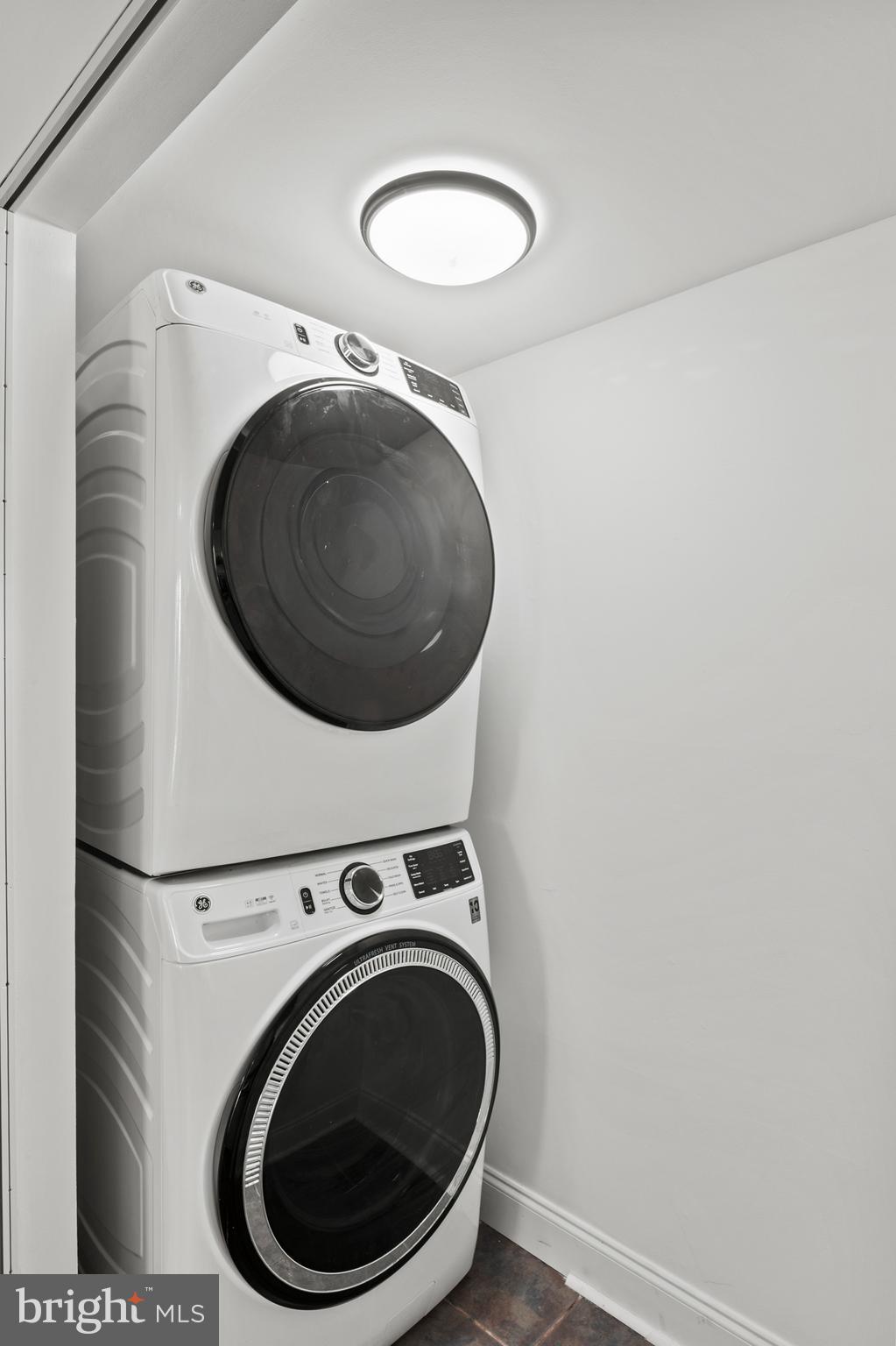 11246 Snowflake Court, Unit A121 Columbia, MD 21044 - Photo 23 of 36 a utility room with dryer and washer