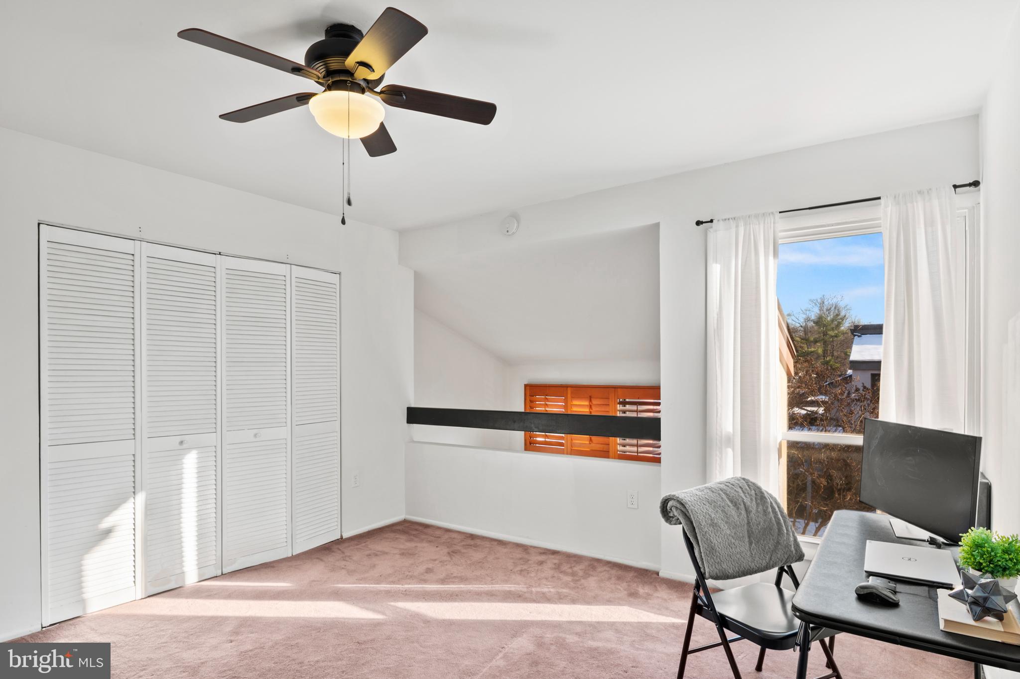11246 Snowflake Court, Unit A121 Columbia, MD 21044 - Photo 25 of 36 a living room with furniture and a window