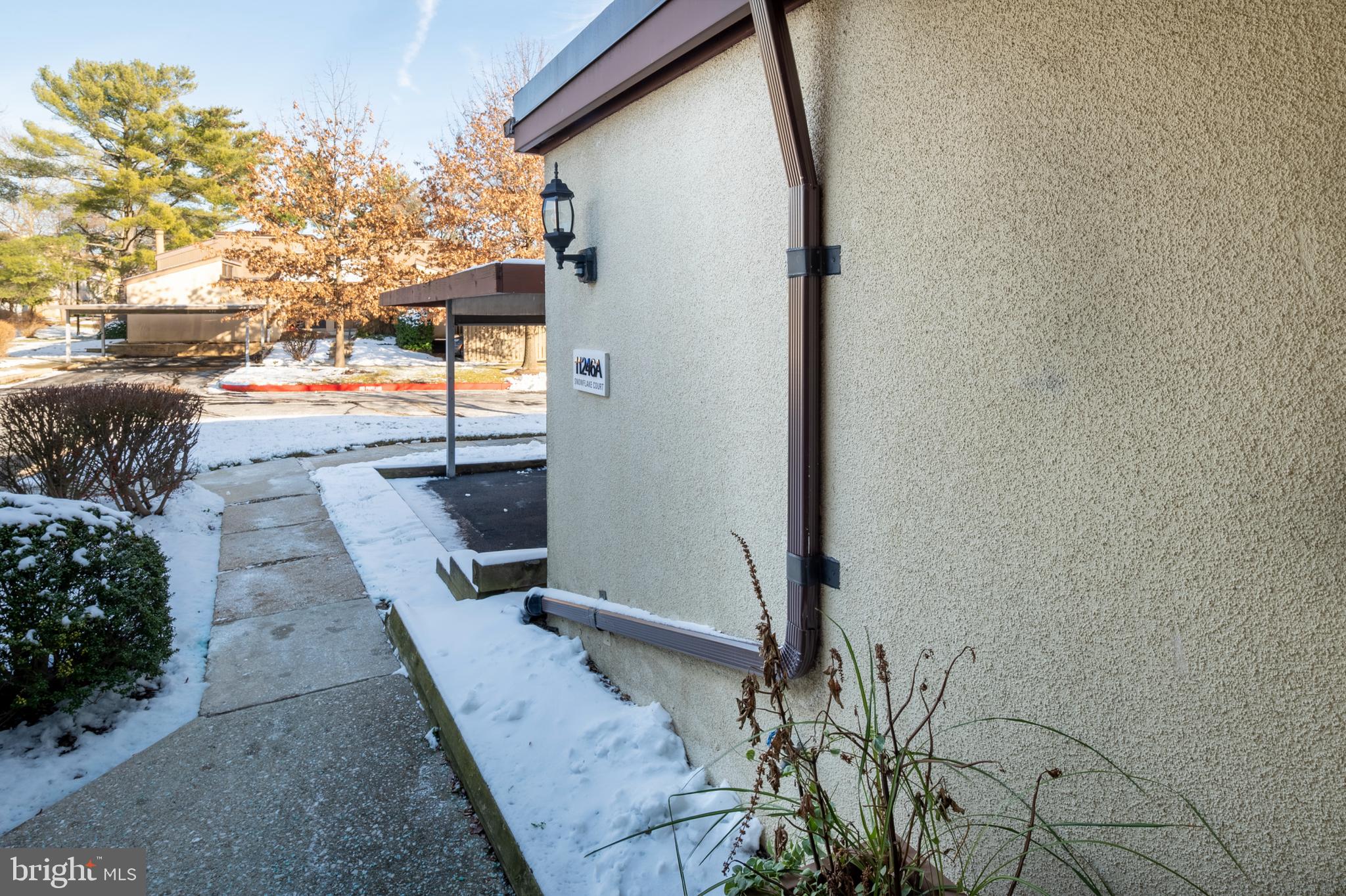 11246 Snowflake Court, Unit A121 Columbia, MD 21044 - Photo 3 of 36 a backyard of a house with a tree
