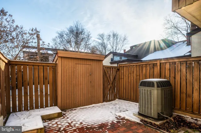a backyard of a house with barbeque oven
