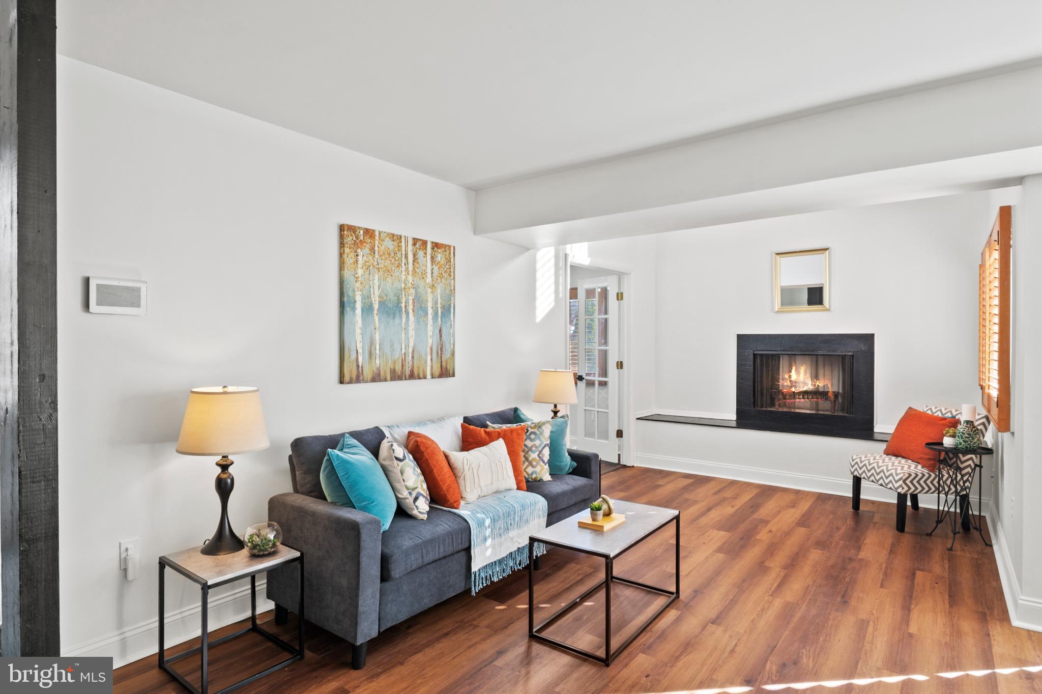 11246 Snowflake Court, Unit A121 Columbia, MD 21044 - Photo 4 of 36 a living room with furniture and wooden floor