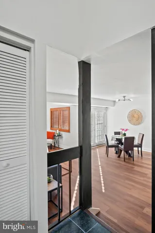 a dining room with furniture and wooden floor