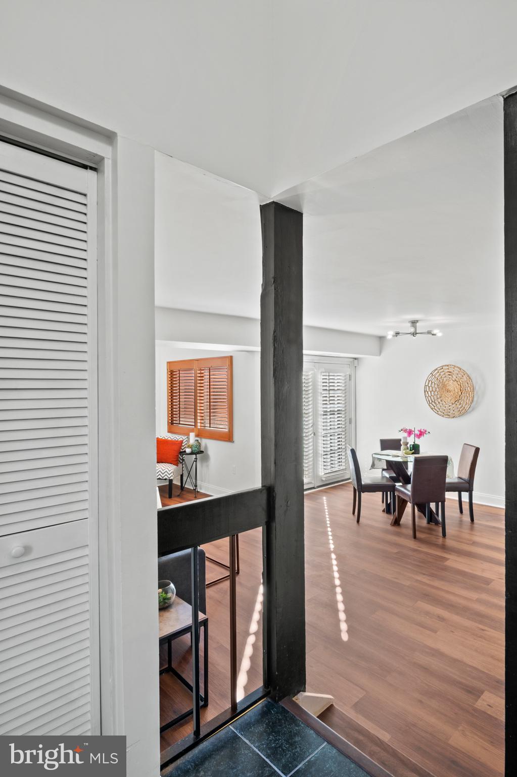 11246 Snowflake Court, Unit A121 Columbia, MD 21044 - Photo 7 of 36 a dining room with furniture and wooden floor