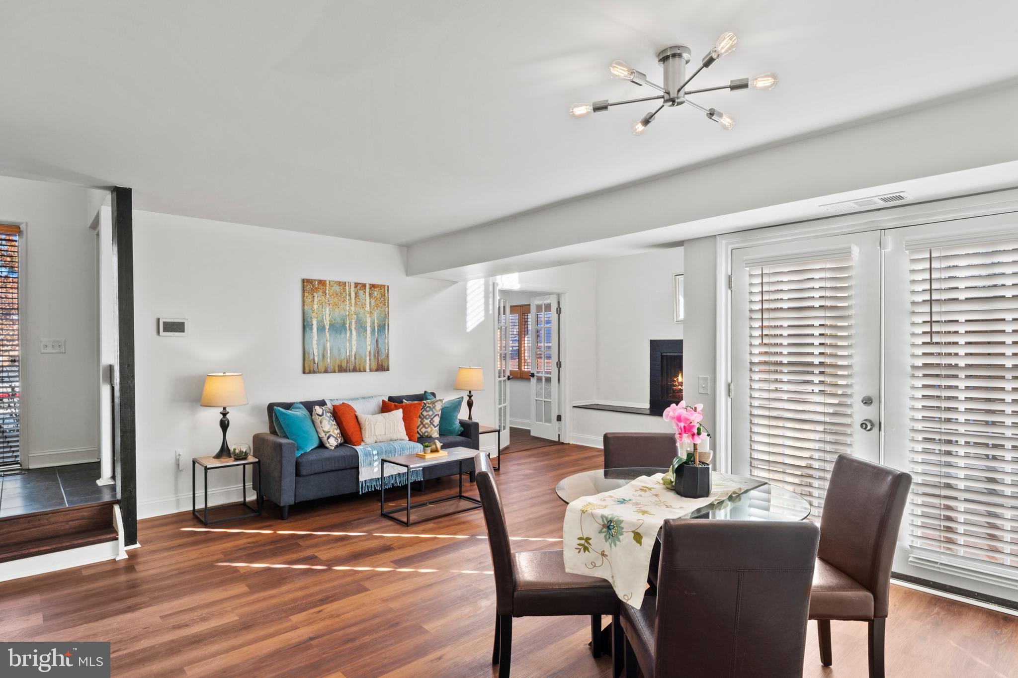 11246 Snowflake Court, Unit A121 Columbia, MD 21044 - Photo 9 of 36 a living room with furniture and wooden floor