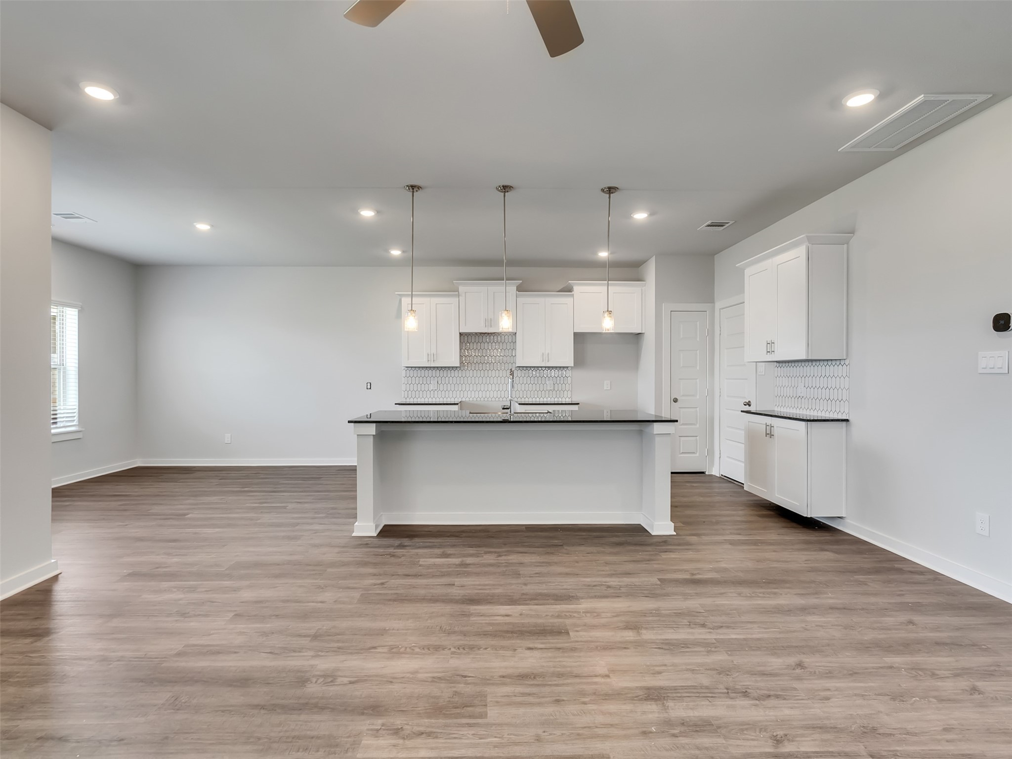 1206 Elsinore Drive Rosharon, TX 77583 - Photo 7 of 21 a large kitchen with stainless steel appliances granite countertop a large counter top a sink and a dishwasher