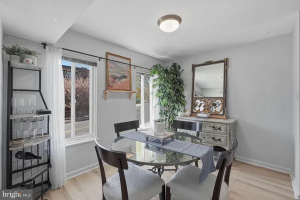 a view of a dining room with furniture and window