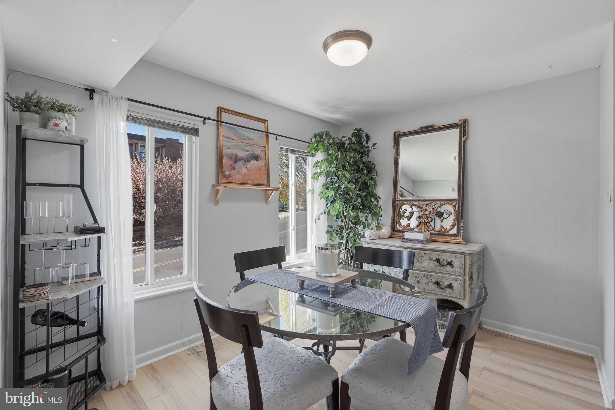 5017 7th Road South, Unit 102 Arlington, VA 22204 - Photo 12 of 40 a view of a dining room with furniture and window