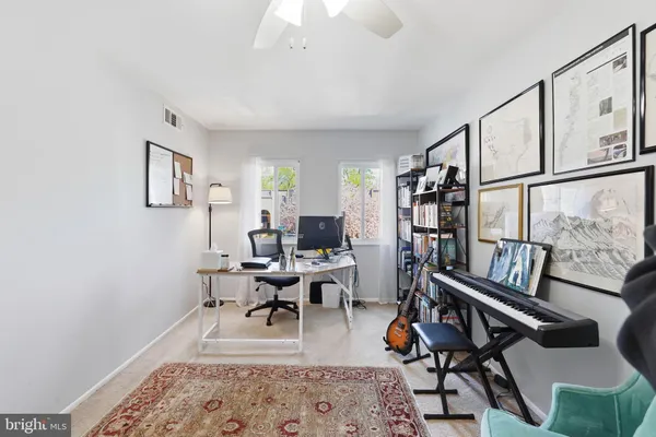 a living room with furniture or couch and a rug