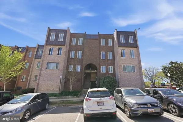 a front view of a house with parking space