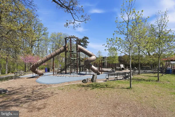 a view of a park with swings and slides