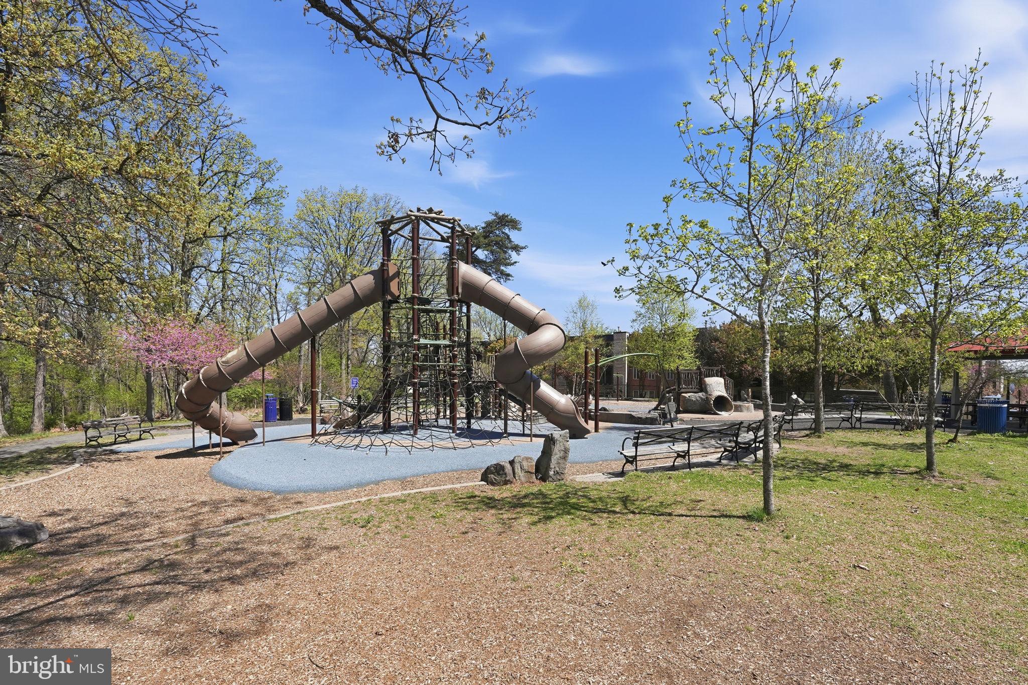 5017 7th Road South, Unit 102 Arlington, VA 22204 - Photo 35 of 40 a view of a park with swings and slides