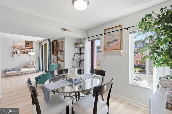 a view of a dining room with furniture and window