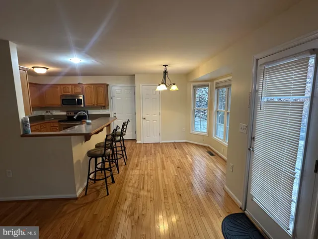 a view of a livingroom with furniture and wooden floor