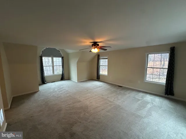 a view of a closet area with empty racks