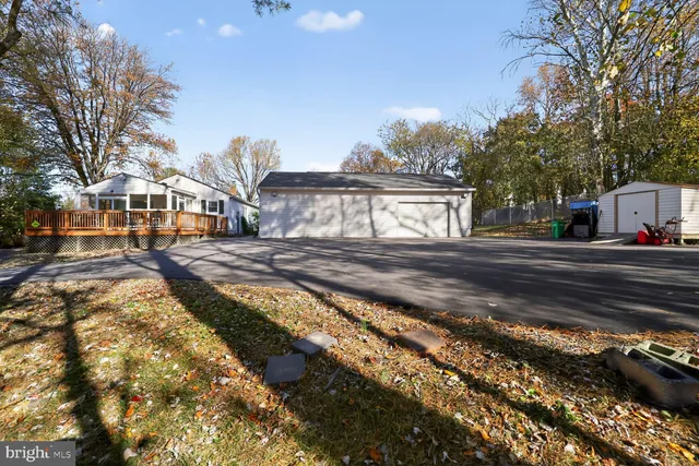 a city view with tall buildings and cars parked on road