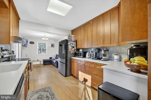 a kitchen with a sink stove and refrigerator