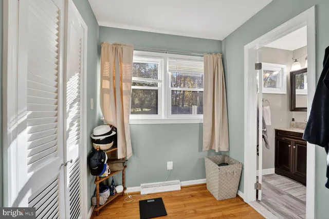 a view of a livingroom with furniture and a window
