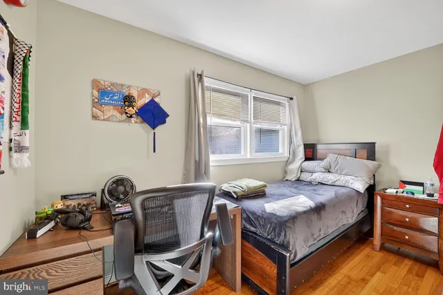 a bedroom with bed and a window