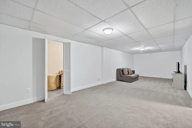 a view of a livingroom with kitchen