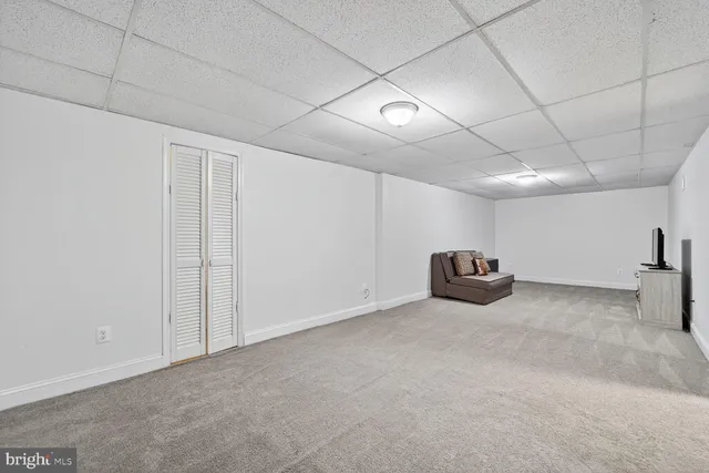a view of a livingroom with a refrigerator