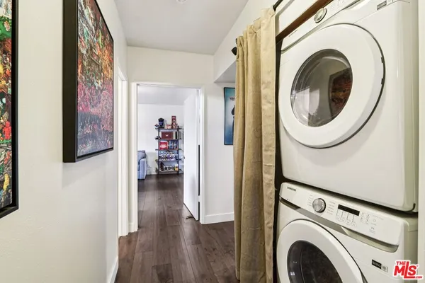 a view of a hallway with washer and dryer