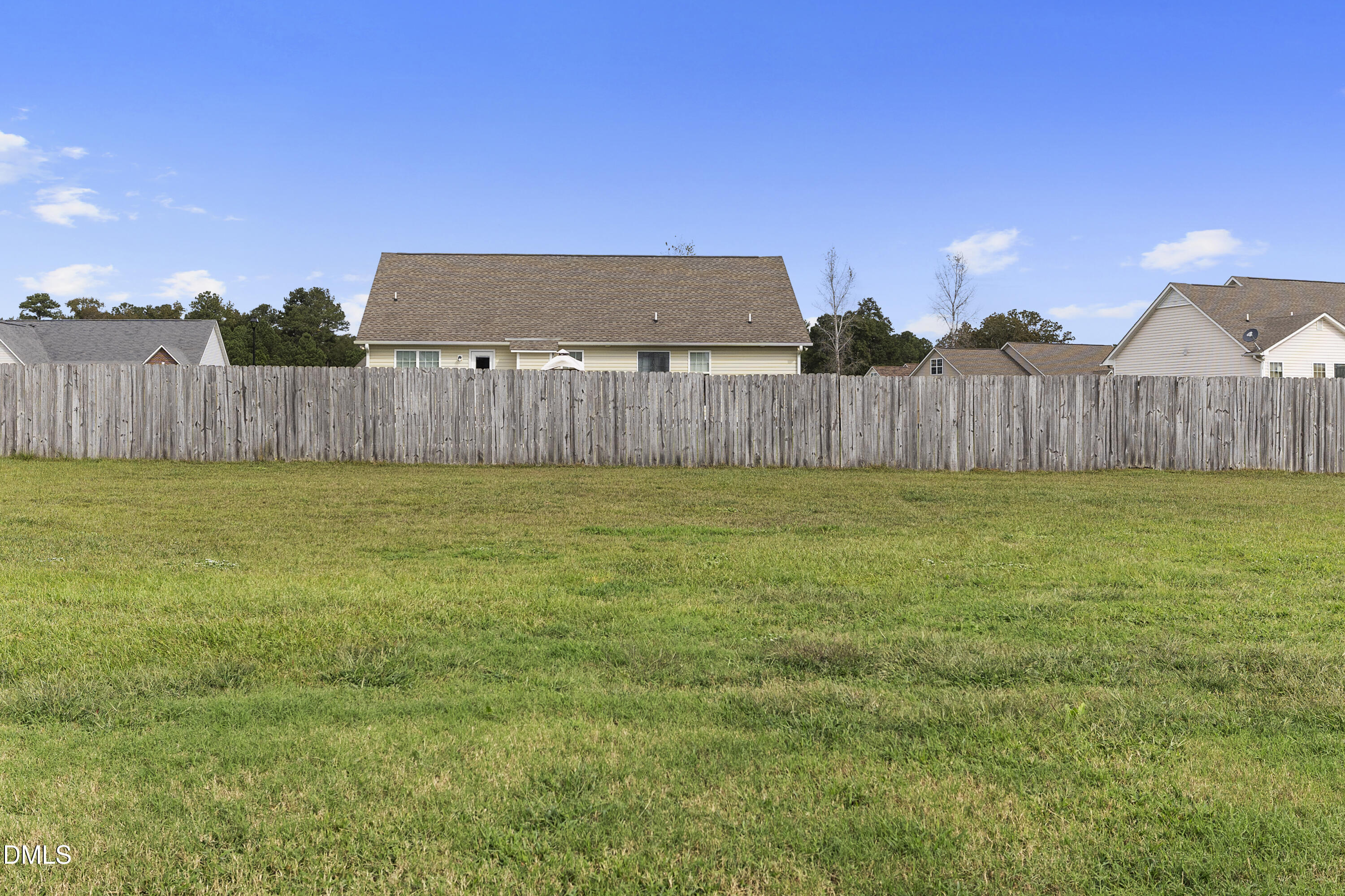 298 Declaration Drive Raeford, NC 28376 - Photo 10 of 58 a view of a backyard with wooden fence