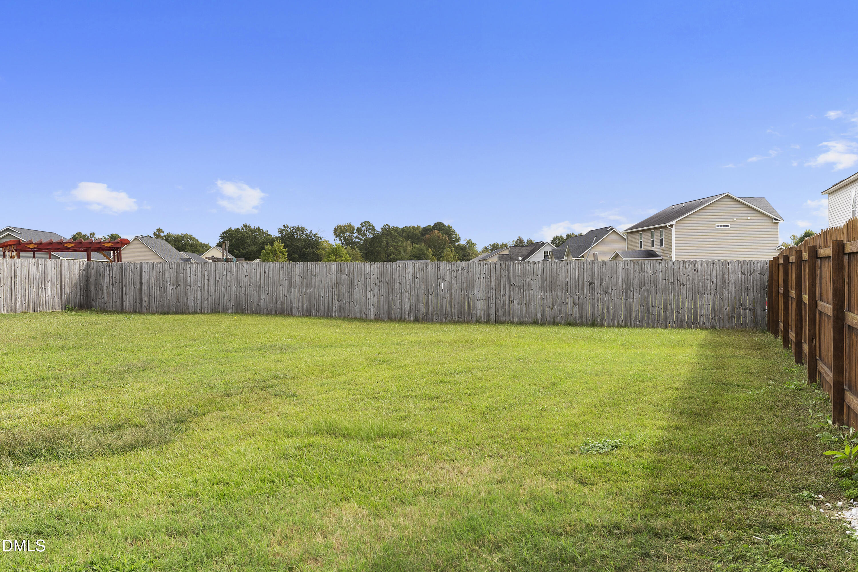 298 Declaration Drive Raeford, NC 28376 - Photo 12 of 58 a view of a backyard with a fence