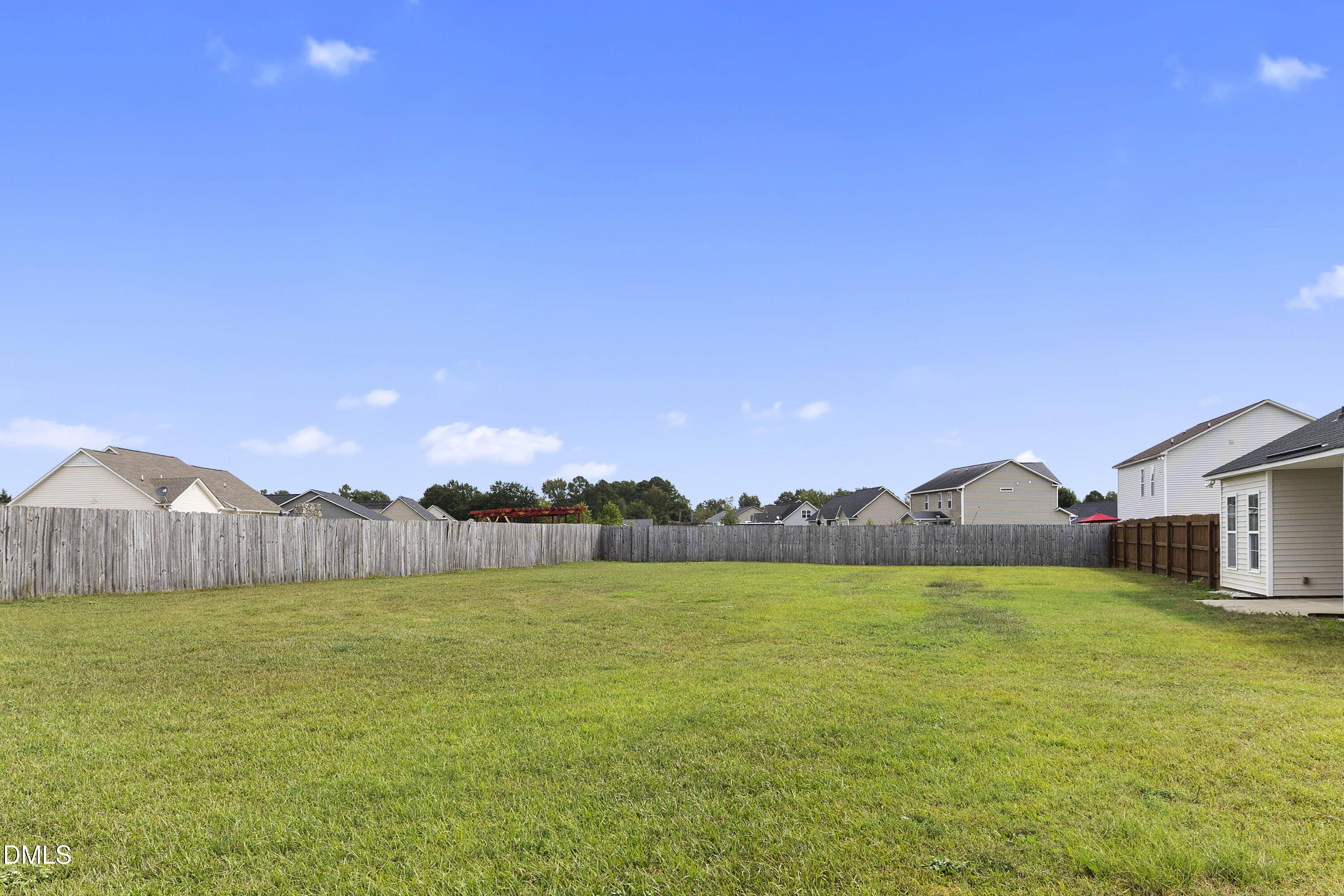 298 Declaration Drive Raeford, NC 28376 - Photo 17 of 58 a view of a lake with a house in the background