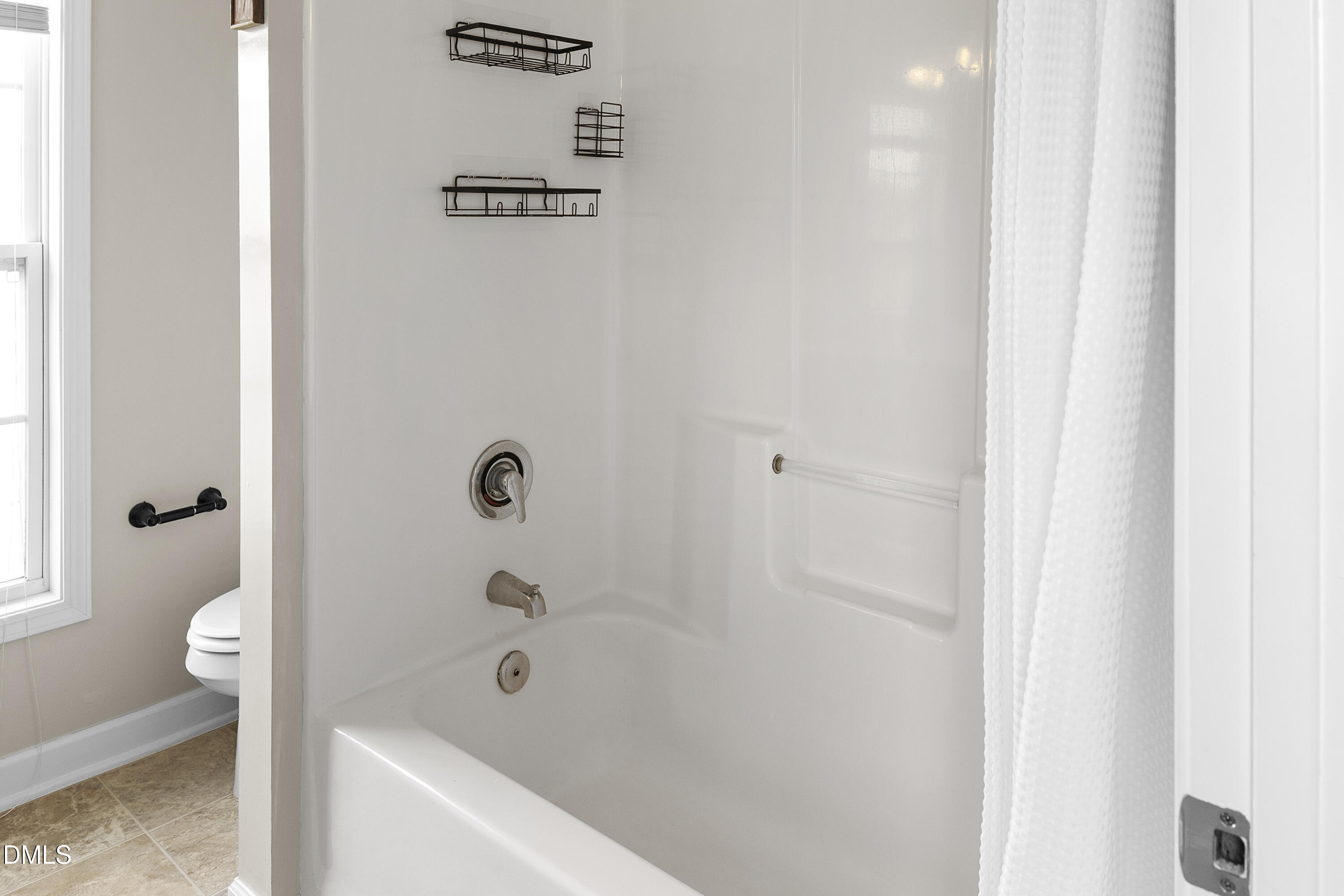 298 Declaration Drive Raeford, NC 28376 - Photo 21 of 58 a bathroom with a bathtub