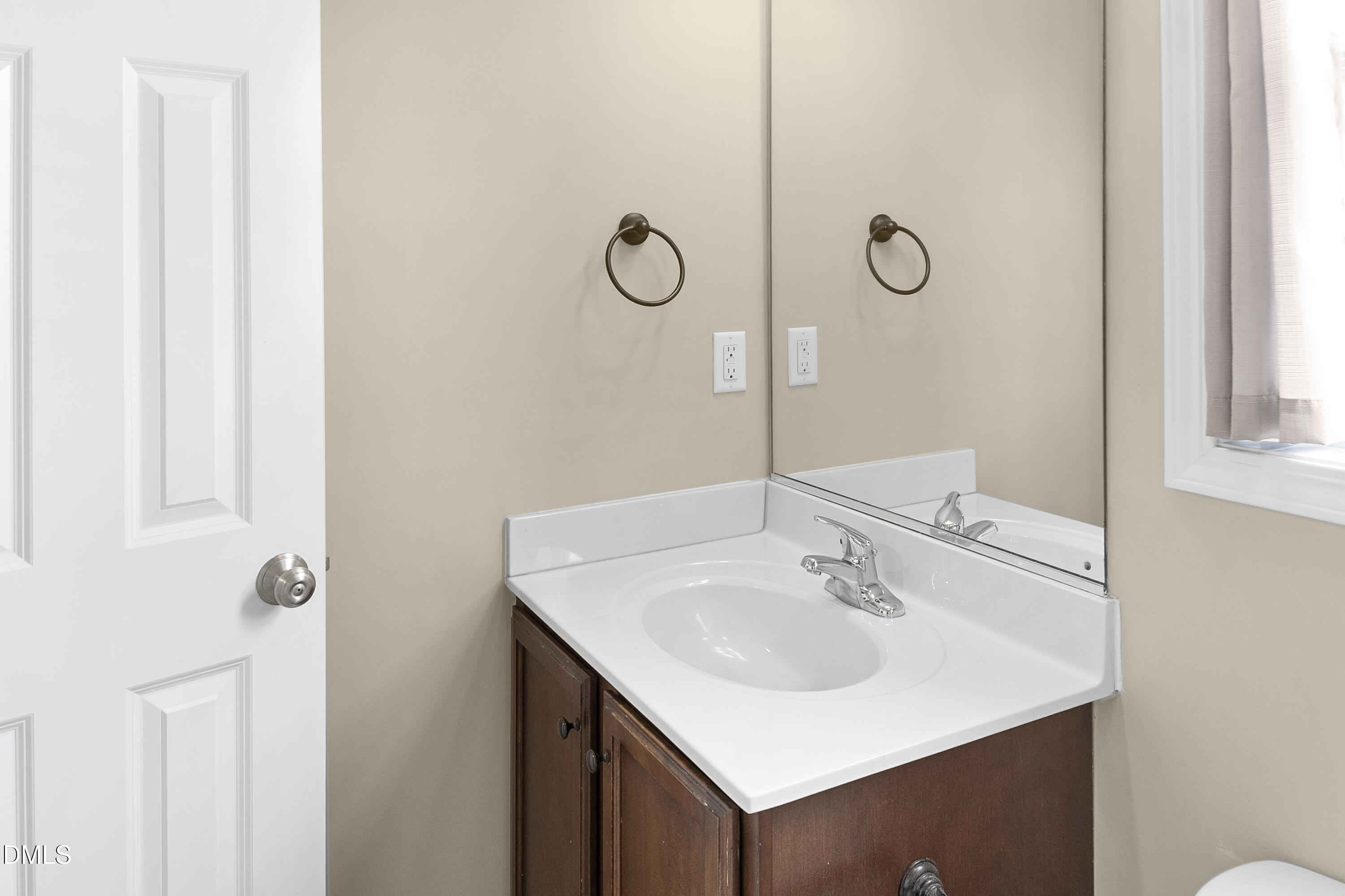 298 Declaration Drive Raeford, NC 28376 - Photo 24 of 58 a bathroom with a sink and mirror