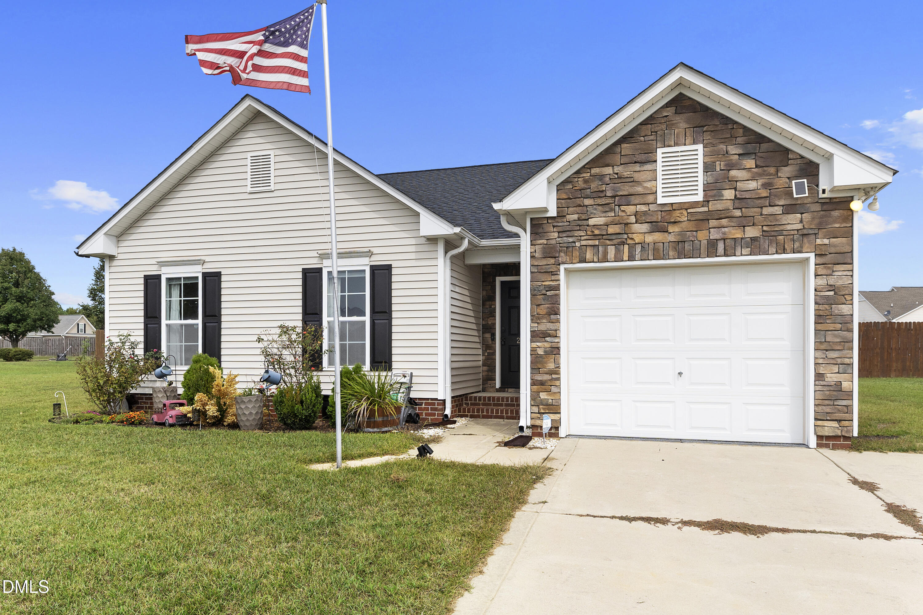 298 Declaration Drive Raeford, NC 28376 - Photo 2 of 58 a front view of a house with garden