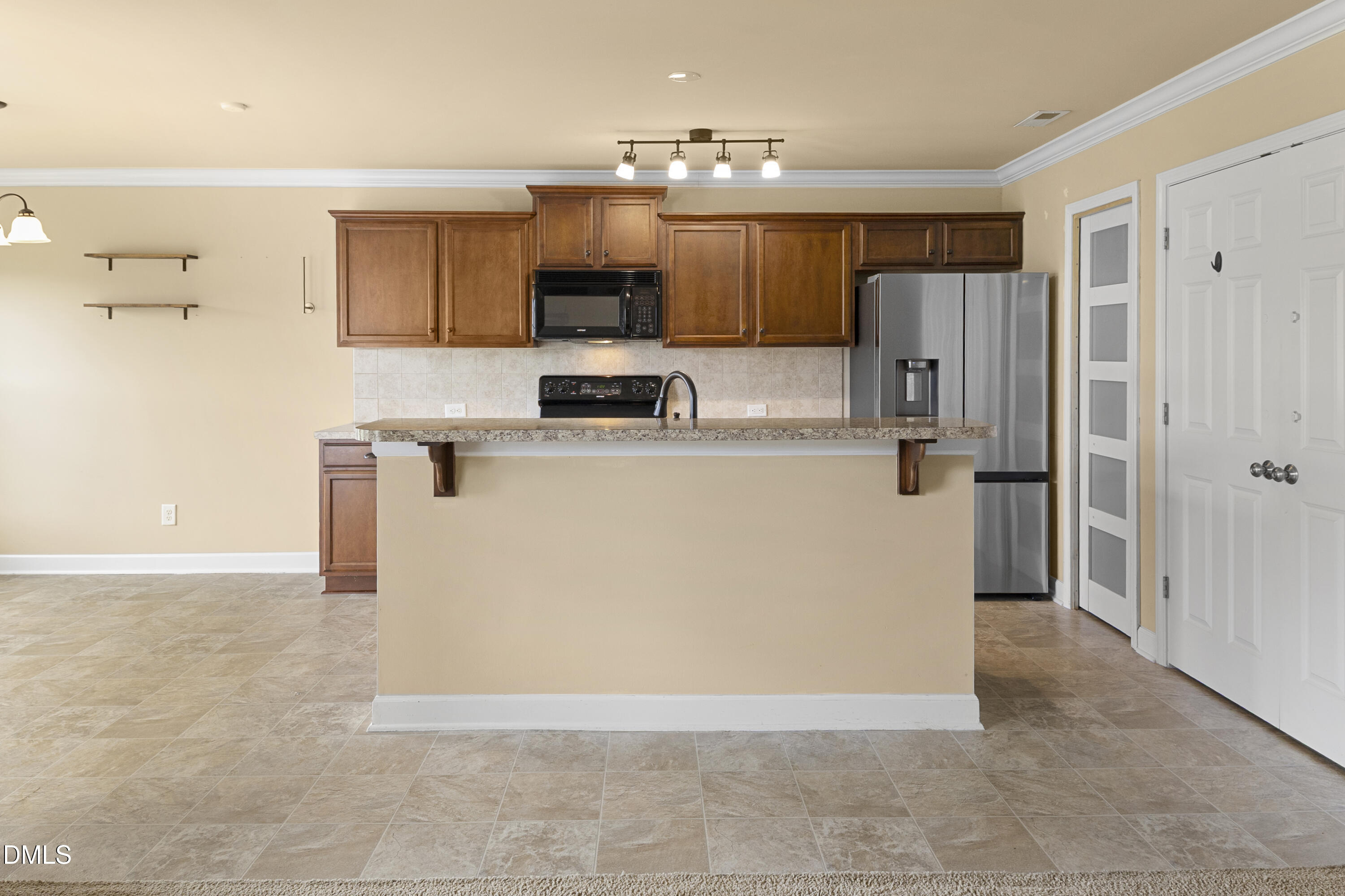 298 Declaration Drive Raeford, NC 28376 - Photo 39 of 58 a view of a kitchen with microwave and refrigerator