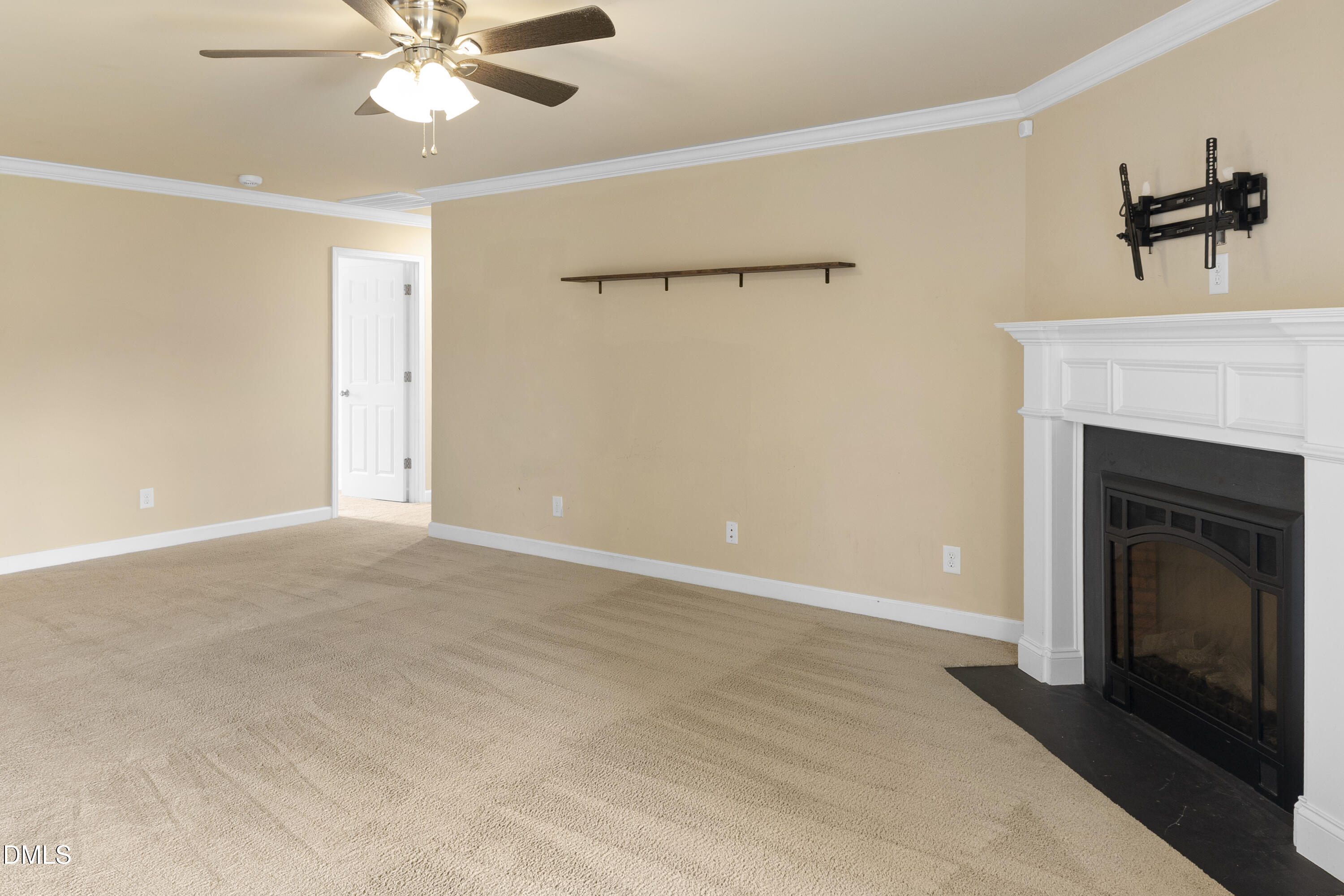 298 Declaration Drive Raeford, NC 28376 - Photo 47 of 58 a view of a livingroom with a fireplace and ceiling fan