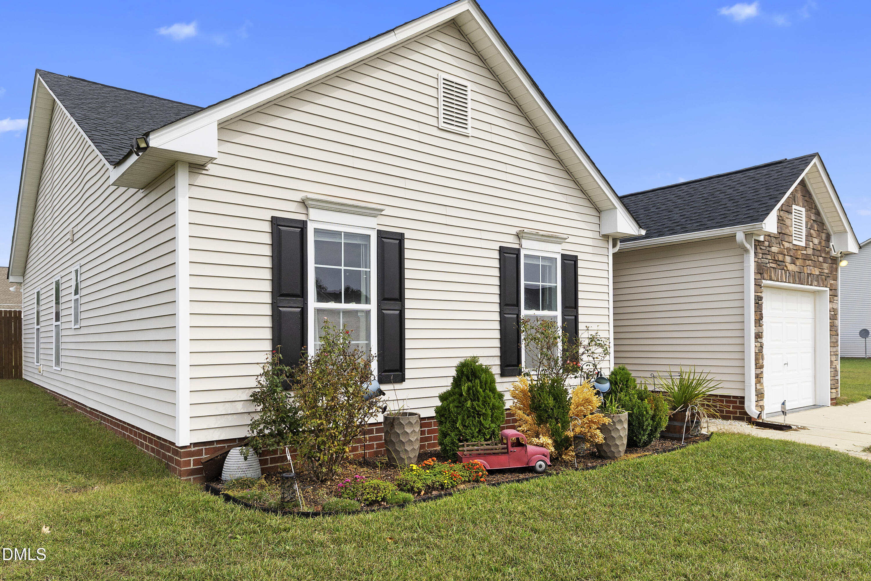 298 Declaration Drive Raeford, NC 28376 - Photo 4 of 58 a view of a house with a yard and lawn chairs