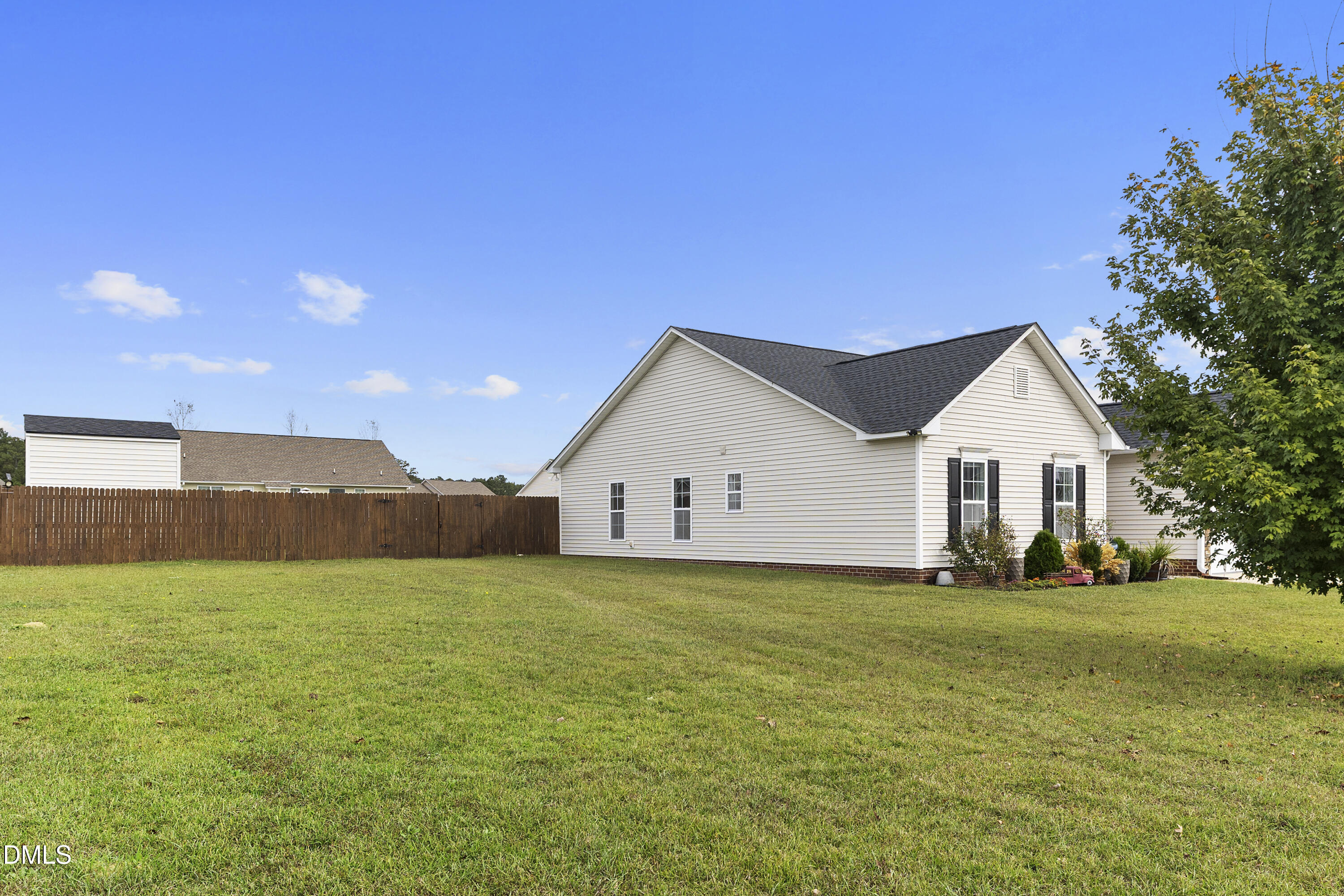 298 Declaration Drive Raeford, NC 28376 - Photo 5 of 58 a view of a house with a yard and large trees