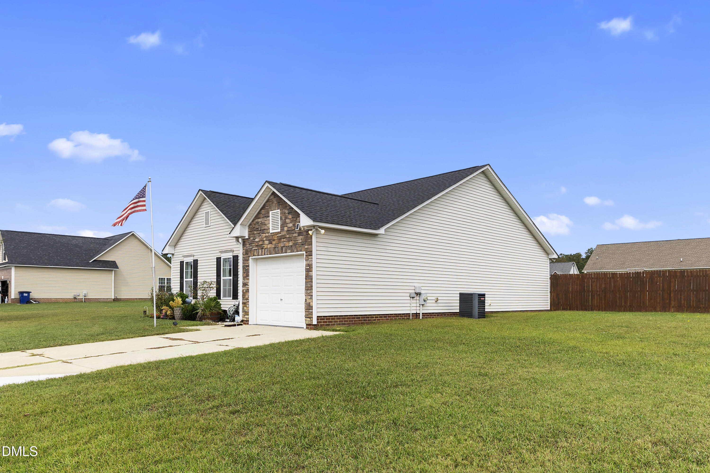 298 Declaration Drive Raeford, NC 28376 - Photo 8 of 58 a front view of a house with a yard and garage