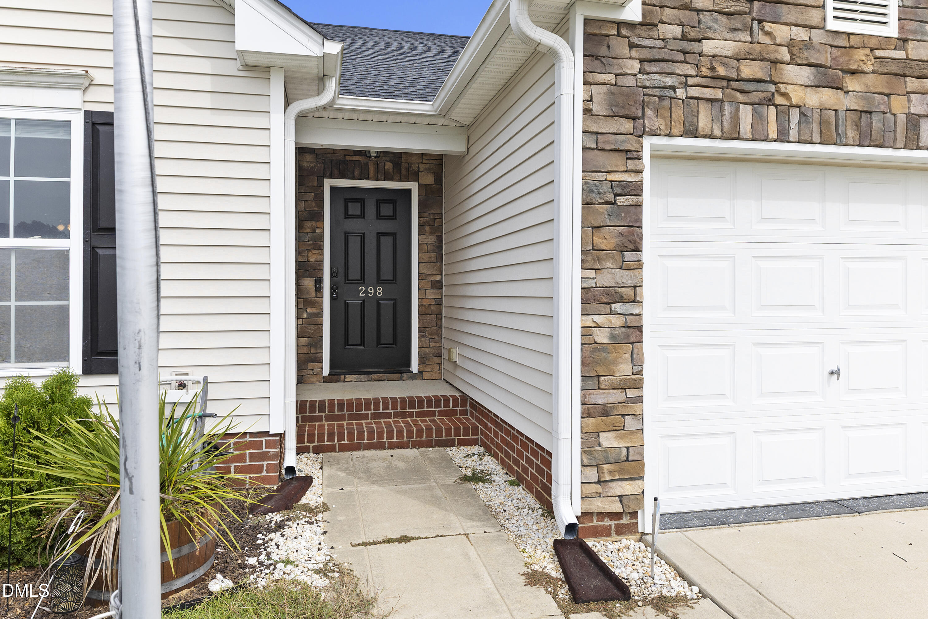 298 Declaration Drive Raeford, NC 28376 - Photo 9 of 58 a front view of a house with a garage